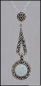 A silver marcasite and opal pendant necklace on a silver chain