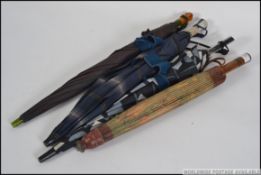 A collection of four vintage parasol / umbrellas,