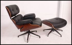 A stunning leather and panel wood armchair and ottoman the manner of Charles Eames ( model no 761 ).