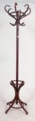 A 20th century bentwood coat stand in the manner of Thonet. Shaped legs to base with hooks atop.