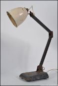 A vintage / retro industrial early to mid 20th century anglepoise style desk lamp,