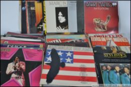 A collection of long play vinyl LP records dating to the 1960's and 1970's to include Joe Cocker,