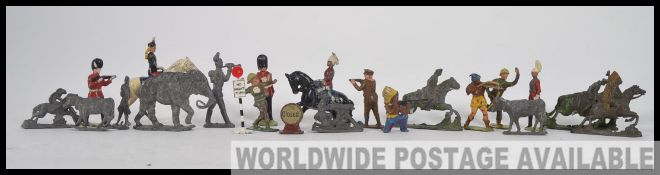 A collection of early 20th century lead ww1 army figures to include maxim gun soldier, cavalry x 2,