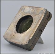 A silver hallmarked pocket watch easel stand,