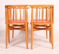 A set of four retro mid 20th century beech dining chairs,