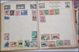 A collection of three stamp albums containing stamps dating from the earlier part of the 20th