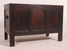 A Victorian carved oak country coffer / blanket box raised on stile supports with fielded panel