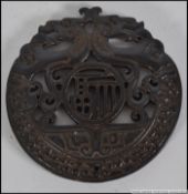 A detailed carved Chinese Jade bi depicting dragons.