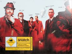 A framed and glazed advertising cinema poster for Snatch being signed for Vinnie Jones? Measures: