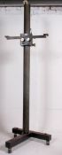 A large and unusual Industrial 20th century adjustable tripod camera stand on dolly wheel base.