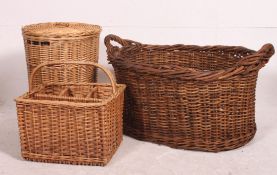 A collection of whicker items dating from the 20th century to include baskets, hampers etc.