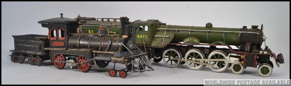 A 20th century tin plate model of the Flying Scotsman train - locomotive together with another.