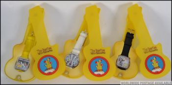 A group of three Beatles ' Yellow Submarine ' collectors wrist watches,