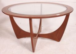 A vintage teak 1970's atomic style oak quarter veneer round coffee table with glass insert top and