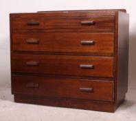 A mid 20th century utility / Air Ministry style straight four mahogany chest of drawers having
