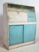A retro 1950's two tone blue and white kitchen cabinet dresser having sliding glass cabinet,