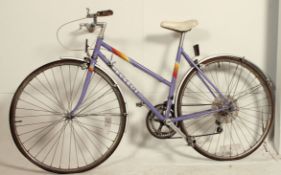 A retro 1980's ladies Premiere road bike - bicycle by Peugeot having original fittings and good