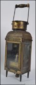 An early 20th century storm lantern stamped Eli H Griffiths and Son's 1913, of rectangular section,