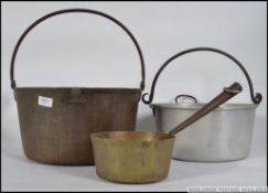 A vintage early 20th century heavy copper preserve pan, along with another similar.