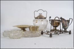 A mixed collection of mid century silver plate items to include bon bon dish , jugs ,