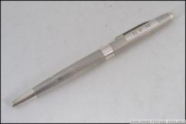 A silver hallmarked pen with monogram mark. Bearing marks for S J Rose & Son, Birmingham. Weight 20.
