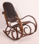A retro bentwood Danish style patchwork leather rocking chair in the manner of Thonet having