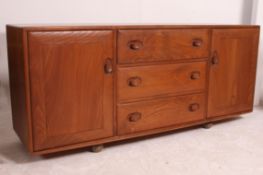 A retro 1960's oak Ercol golden dawn ' Windsor Pattern ' sideboard dresser having a central bank of