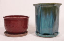 A non matching pair of modern large drip glazed ceramic garden planters,