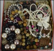 A collection of costume jewellery to include necklaces, watches,