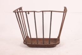 A large 19th century cast iron agricultural / industrial hay feeder of railed tapering form being
