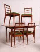 A mid 20th century retro teak dining suite by Macintosh Furniture Ltd comprising an extending