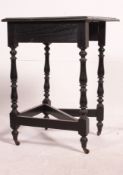 A Victorian carved Jacobean oak revival corner table raised on turned legs having one corner drop
