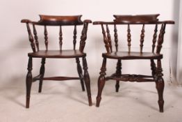 A pair of 19th century Victorian beech and elm smokers bows / windsor armchairs being on turned