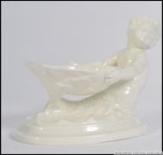 A Royal Worcester table salt believed to be entitled ' Little Mermaid ' and modelled by FG Doughty.