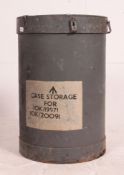 A grey cylindrical military Industrial storage barrel in grey with notation,