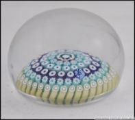 A believed Perthshire 1974 millefiori cane paperweight having date to cane with a believed P or