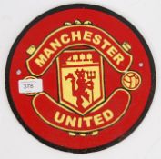 A cast iron wall plaque detailed and painted for Manchester United.