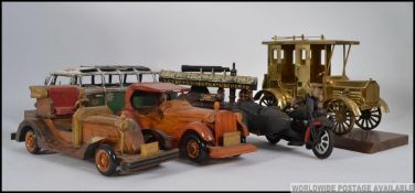 A collection of vintage wooden model cars together with a tin plate traction engine,