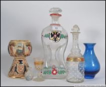 A 19th Century Austrian Square Kluk Kluk decanter having raised floral and leaf decoration and