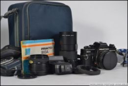 A cased Praktica BCA electronic 35 mm camera with accessories to include light meter,
