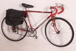 A vintage / retro 20th century Puch Pacemaker road bike, a small frame with five sped gears.