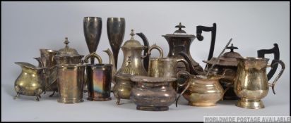 A collection of silver and plated items to include flatware, teapots,