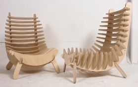 A pair of contemporary modular rib chairs of ply birch construction.