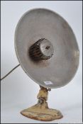 A vintage Pifco style mid century heat lamp, set upon a detachable cast metal base,