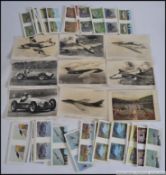 A large box of cigarette cards to include animals, aeroplanes, fish,