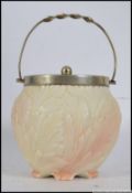 A Locke & Co Worcester porcelain biscuit barrel having ivory blush ground moulded with acanthus