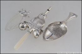 A silver babies rattle with whistle in form of cat ,