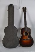 A vintage mid 20th century cased six string acoustic guitar by Martin Colletti,