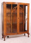 A 1930's Art Deco walnut china display cabinet.