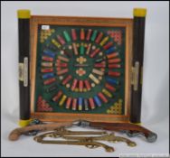 A framed and glazed hanging collection of shotgun cartridges being baize lined within together with